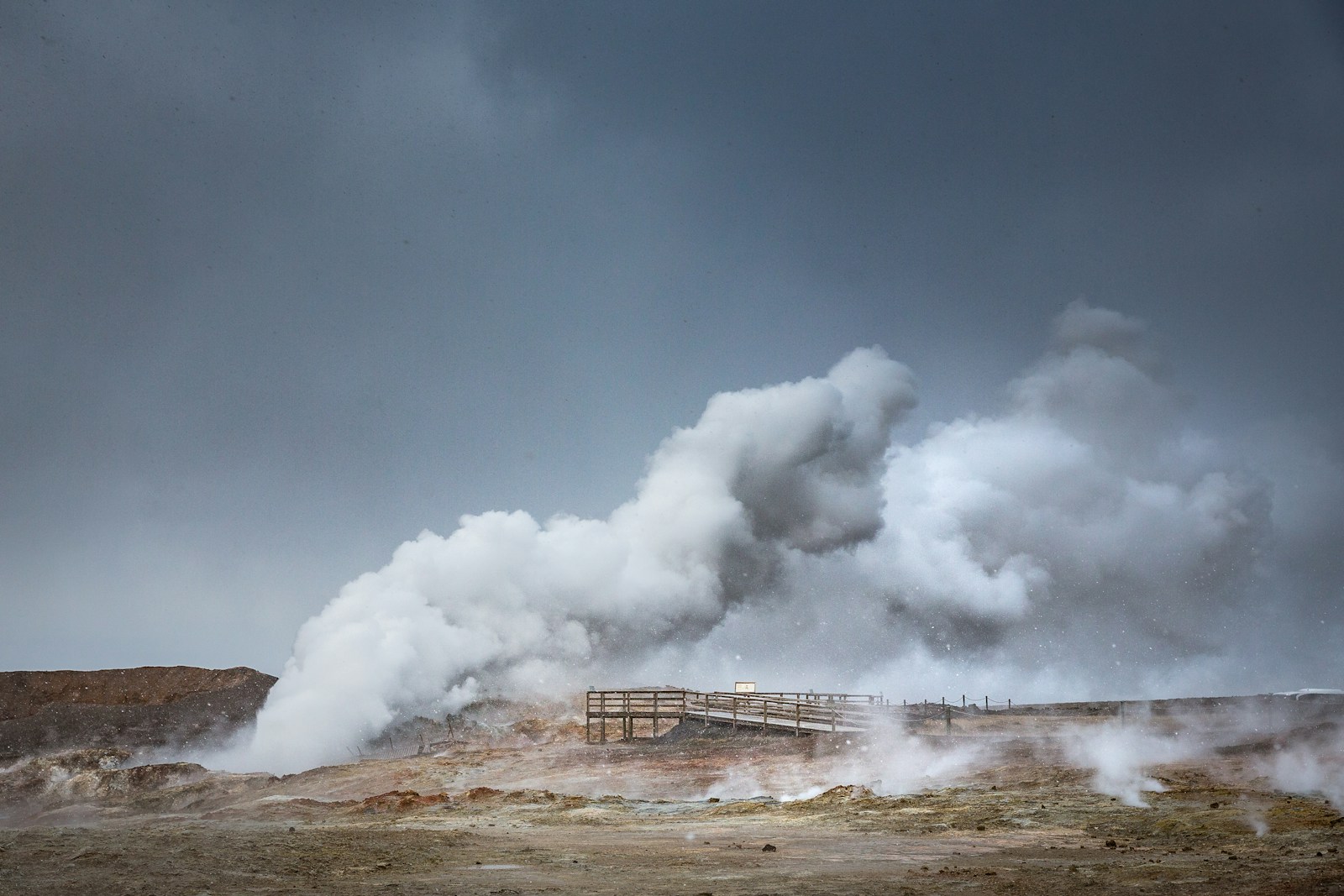 Steam erupts from a geothermal area.